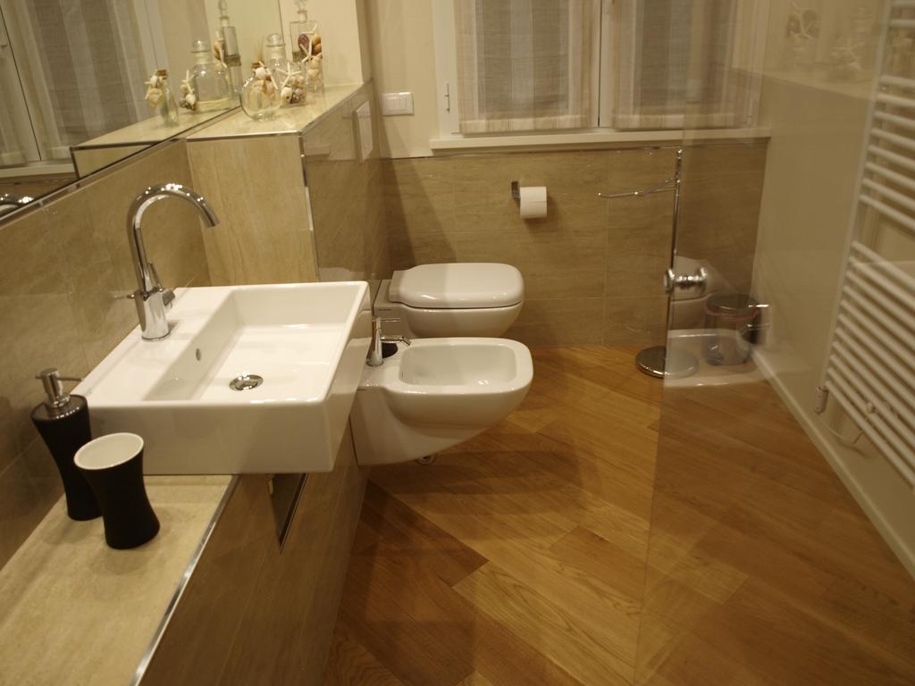 Il Pontile Holidays Apartment Марина-ді-П'єтразанта Номер фото